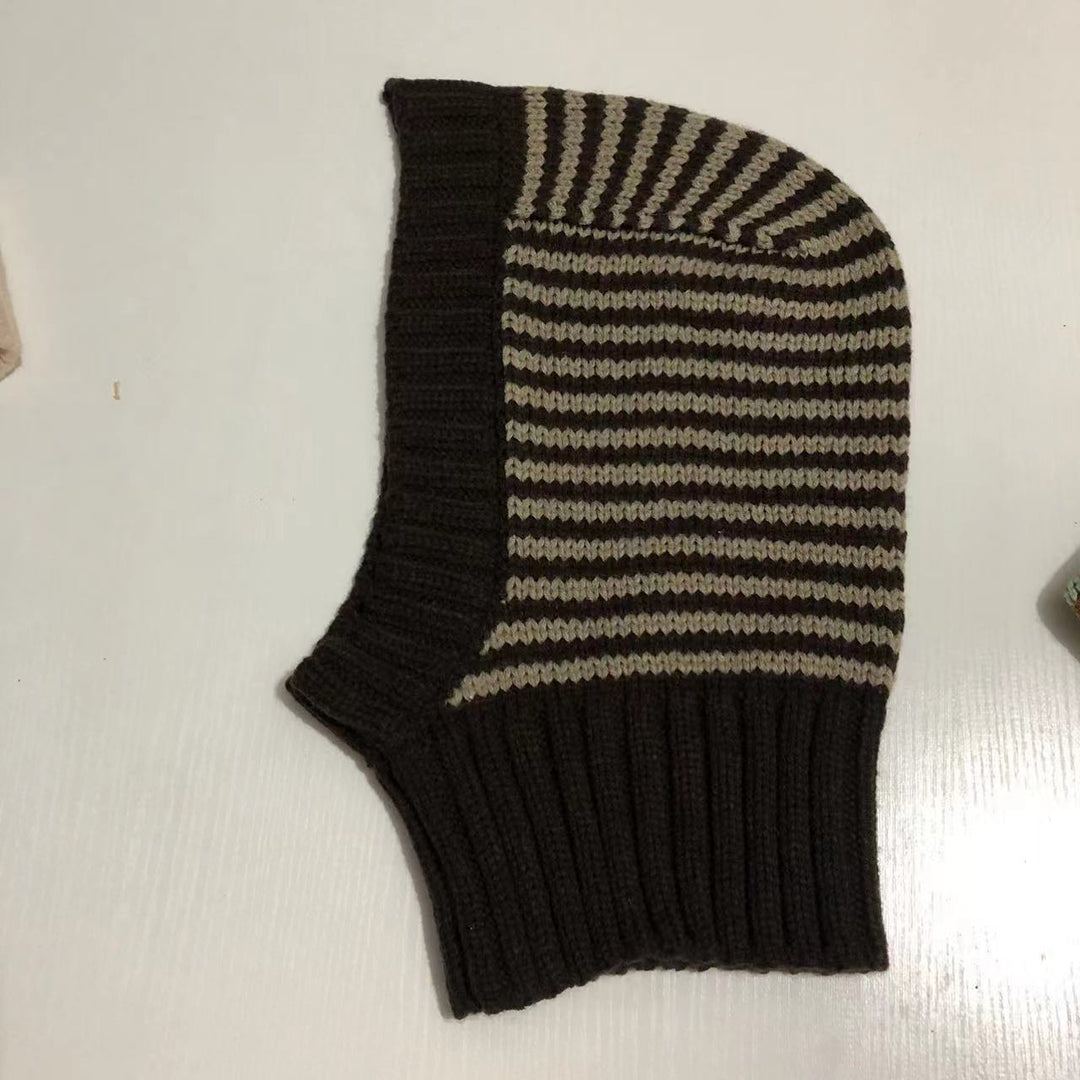 Person wearing striped knitted balaclava hood