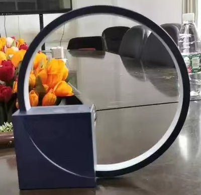 Ring lamp alarm clock glowing on bedside
