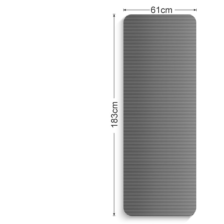 Thick grey exercise mat rolled with carry strap