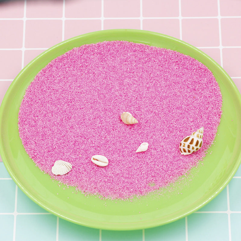 Coloured magic sand shaped underwater