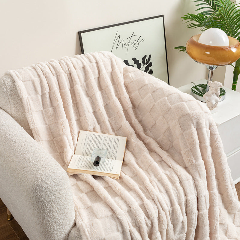 Cream checked plush throw blanket on sofa