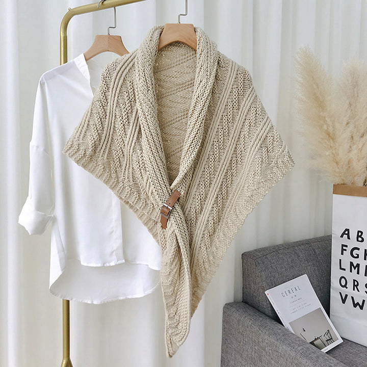Woman in chunky knit triangle scarf with buckle