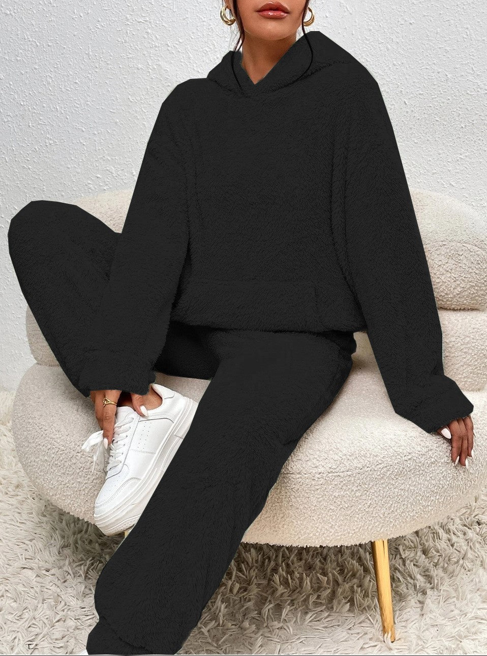 Woman in fluffy teddy hoodie and trousers