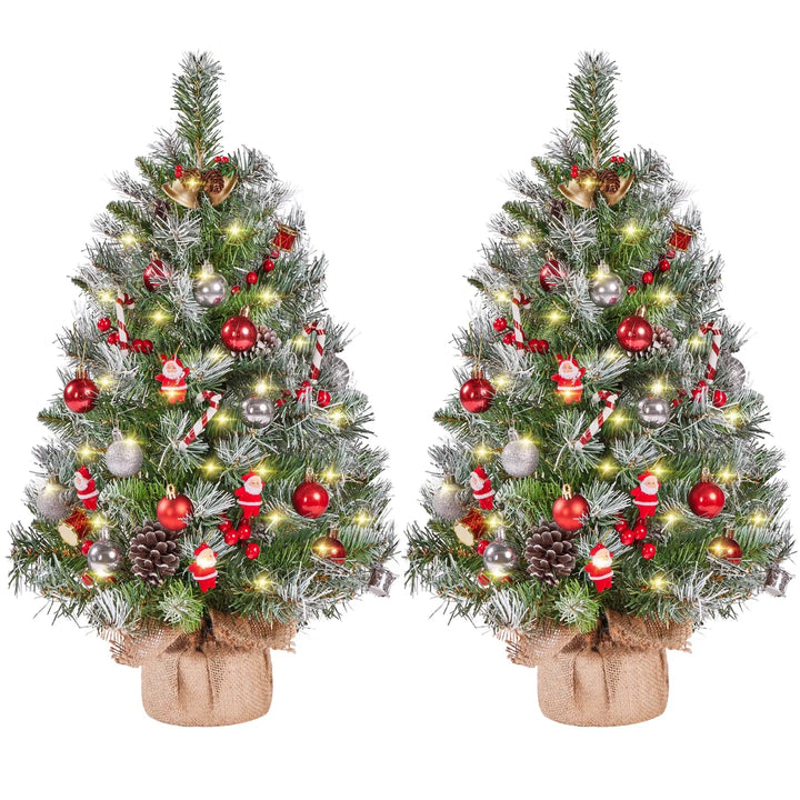 Two frosted tabletop trees with burlap bases