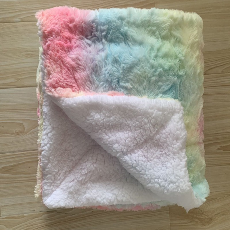 Thick sherpa blanket folded on a sofa