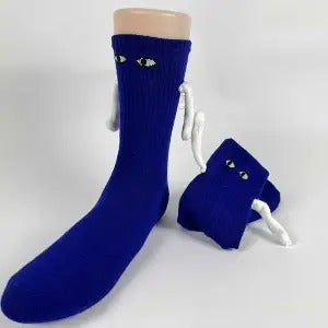 Two socks with magnetic hands holding each other