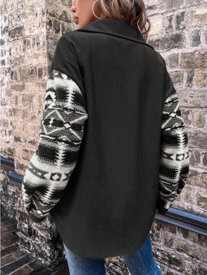 Woman in pink shacket with print sleeves