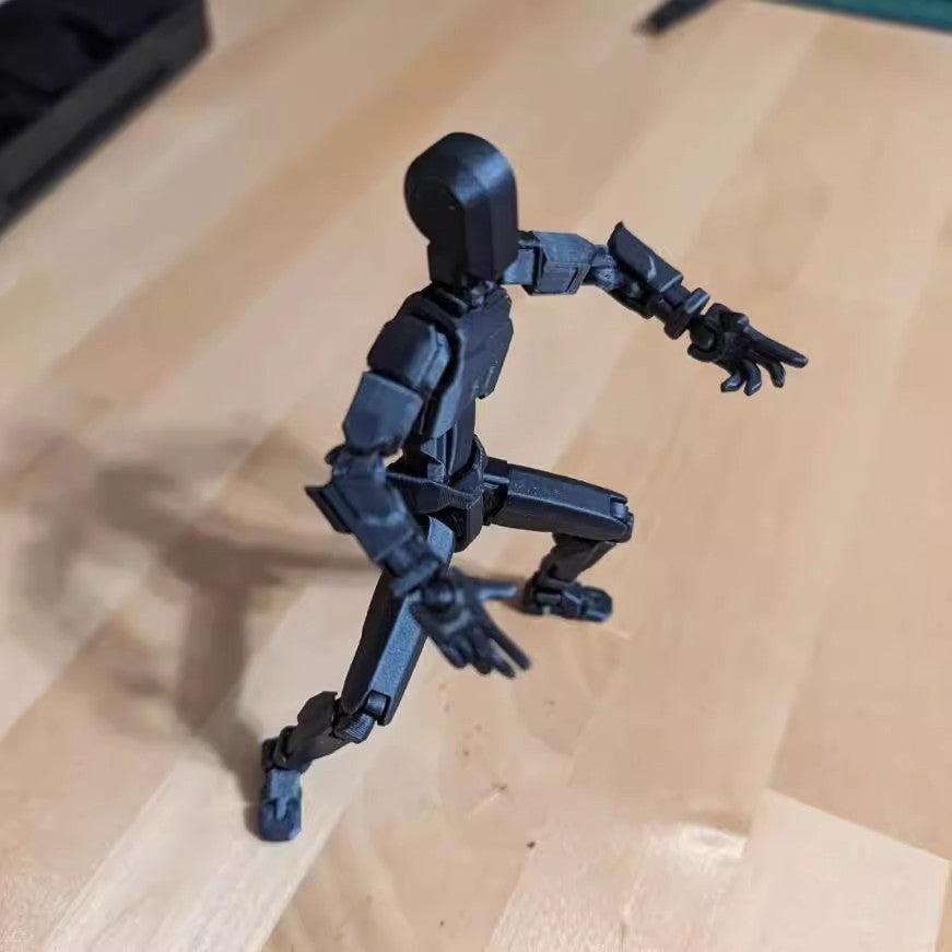 Poseable 3D printed robot figure on desk
