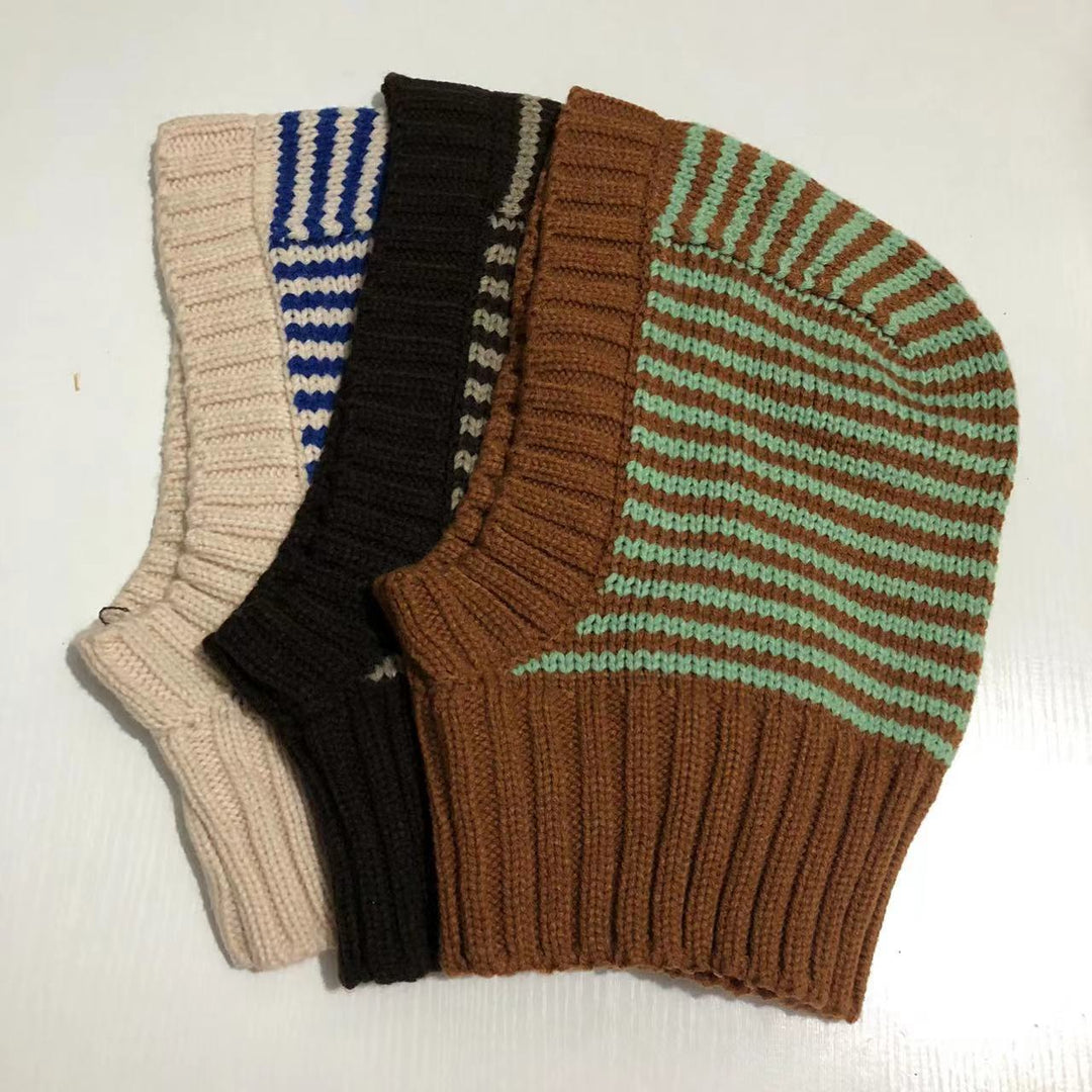 Person wearing striped knitted balaclava hood
