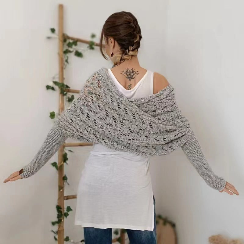 Woman in knitted shrug shawl with sleeves