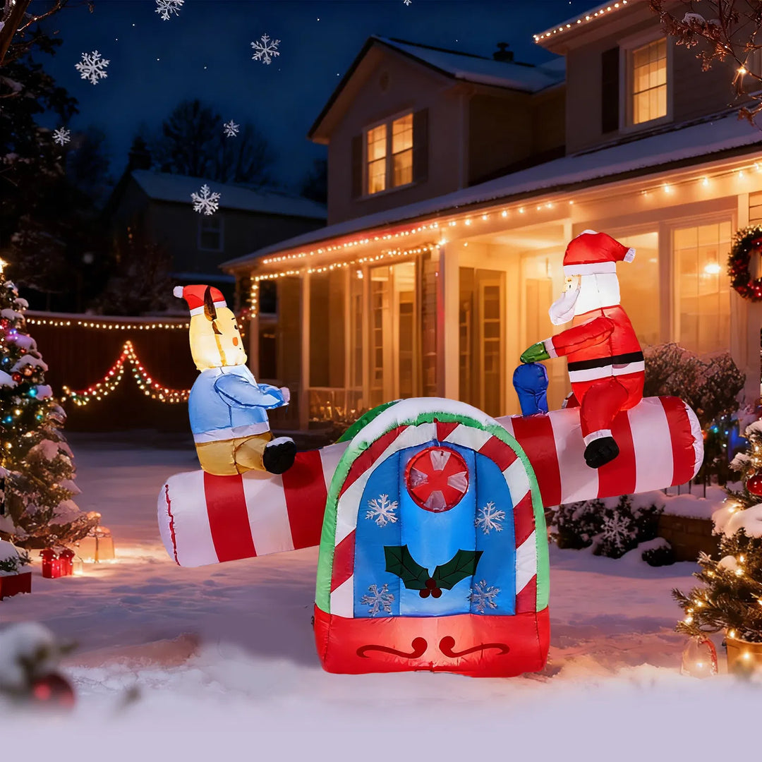 Inflatable Santa and reindeer on seesaw