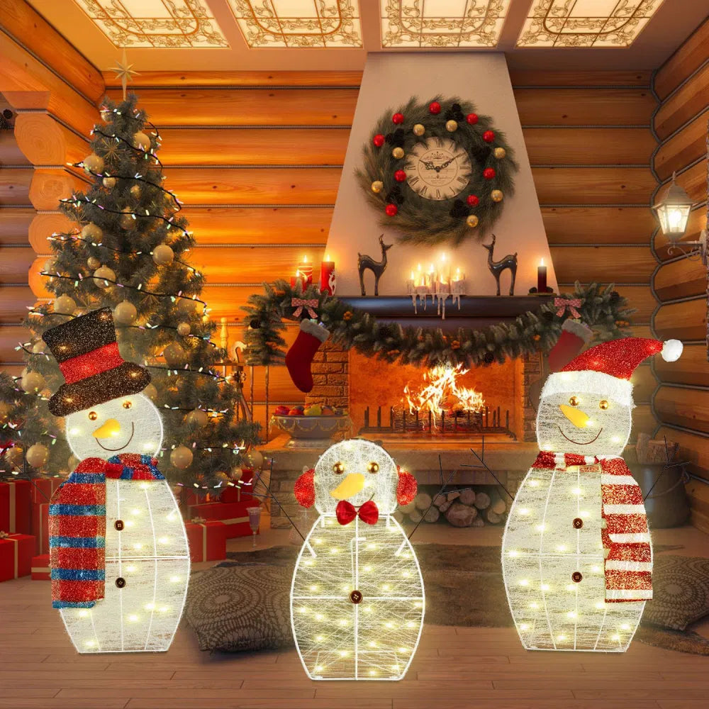 Three plush light-up snowman figures