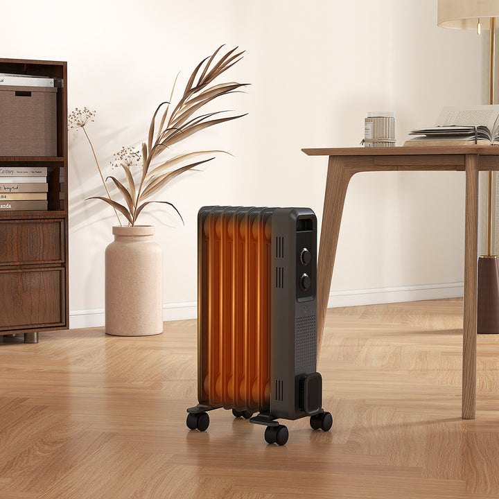 dark grey oil filled radiator with castor wheels