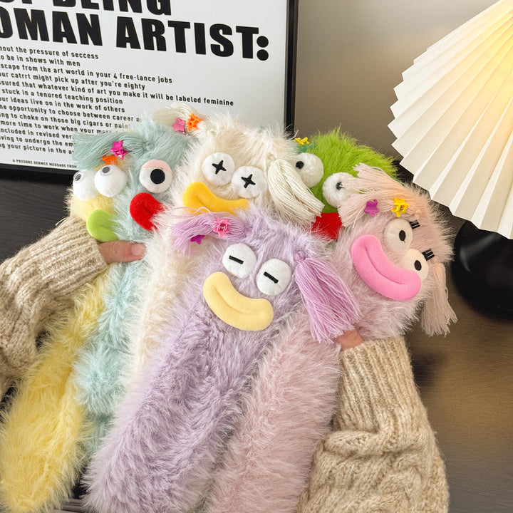 Fluffy socks with googly-eyed monster faces