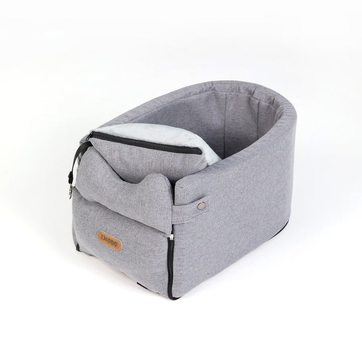 Small dog in armrest car seat