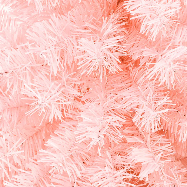 Pink artificial Christmas tree in living room