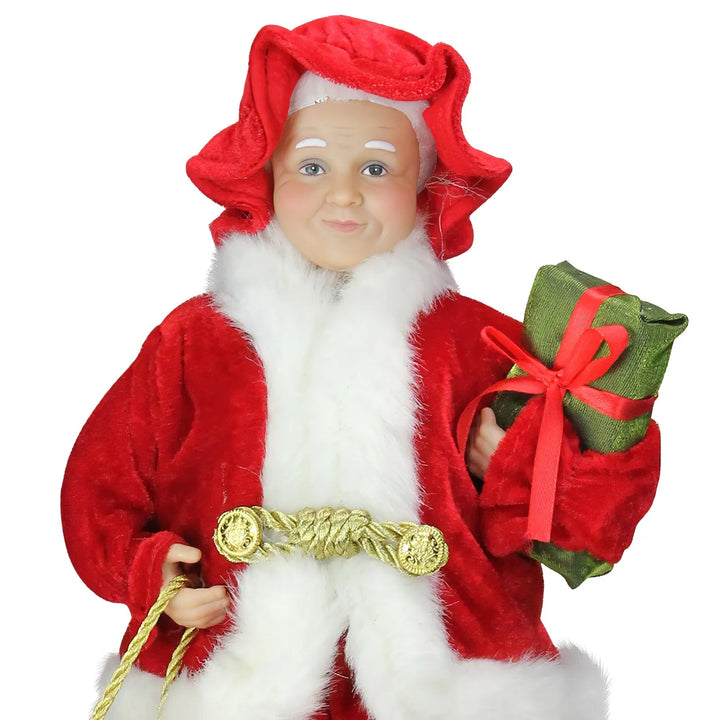 Mrs Claus figure carrying presents