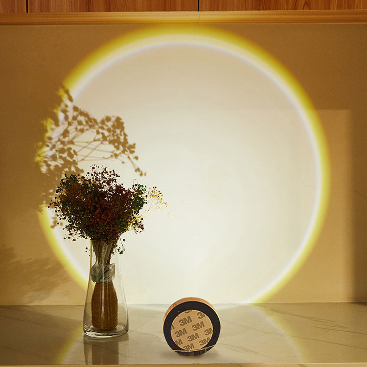 Round light casting sunset glow on wall