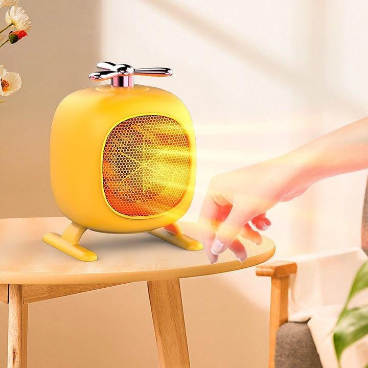 Yellow helicopter-shaped mini fan heater