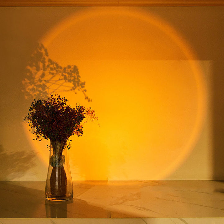 Round light casting sunset glow on wall