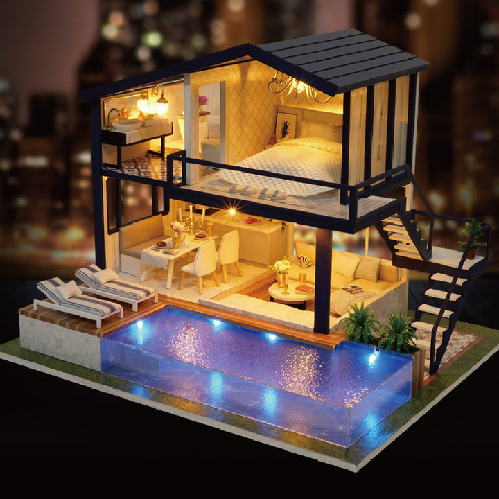 Finished miniature dollhouse with lights on