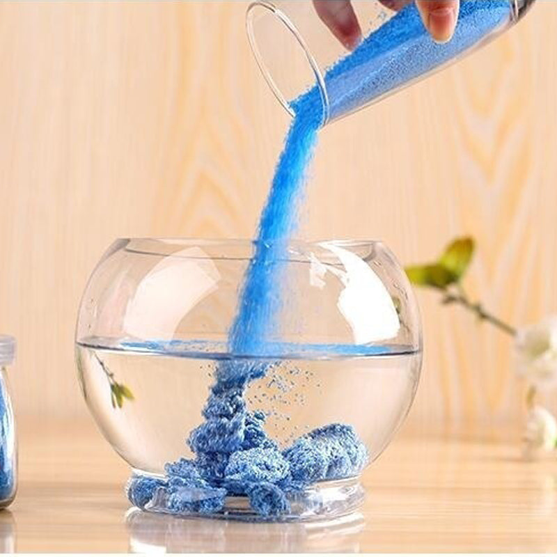 Coloured magic sand shaped underwater