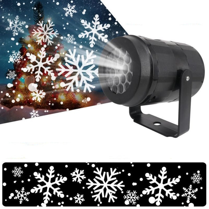 Snowflake projector lighting a house front