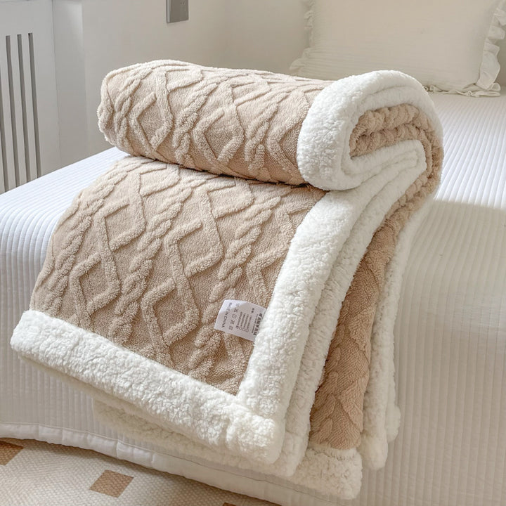 Cream cable knit blanket with sherpa border