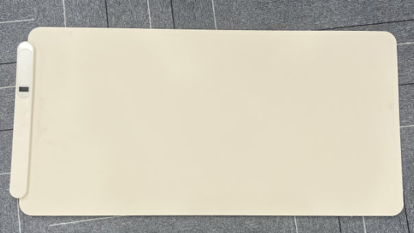 Roll-up graphene food warming mat on table