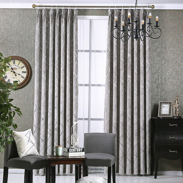 Grey chenille blackout curtain at window