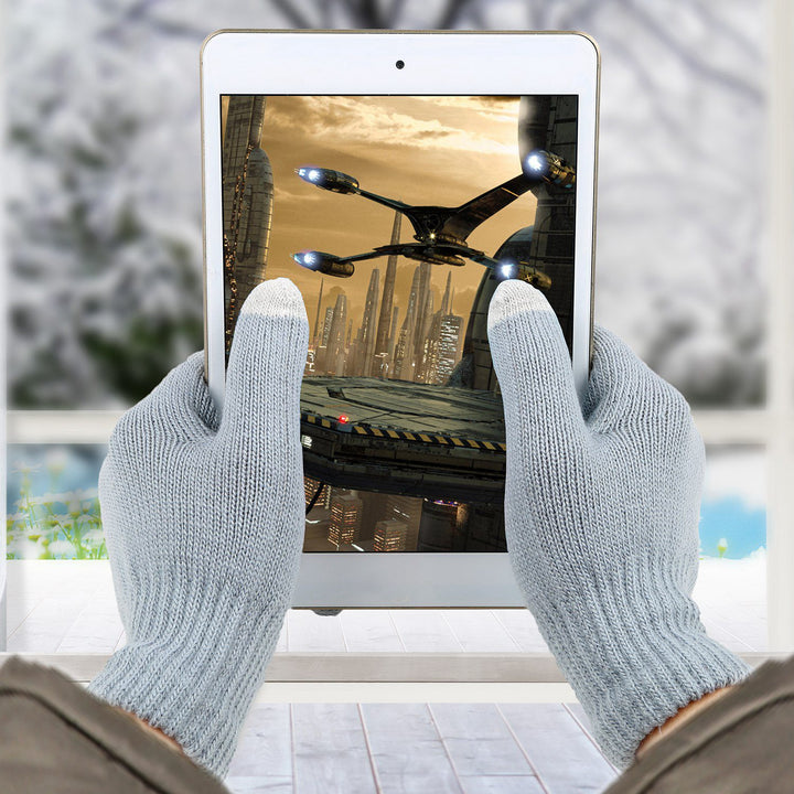 Grey knitted touchscreen gloves using phone