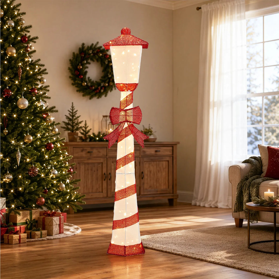 Candy cane striped Christmas lamp post glowing