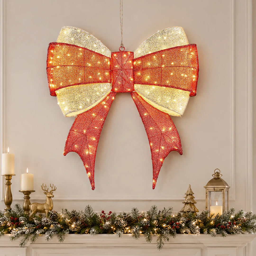 Large lit red and gold Christmas bow