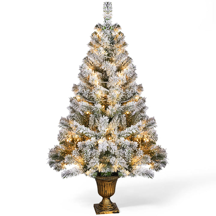 Small flocked tree in a decorative pot