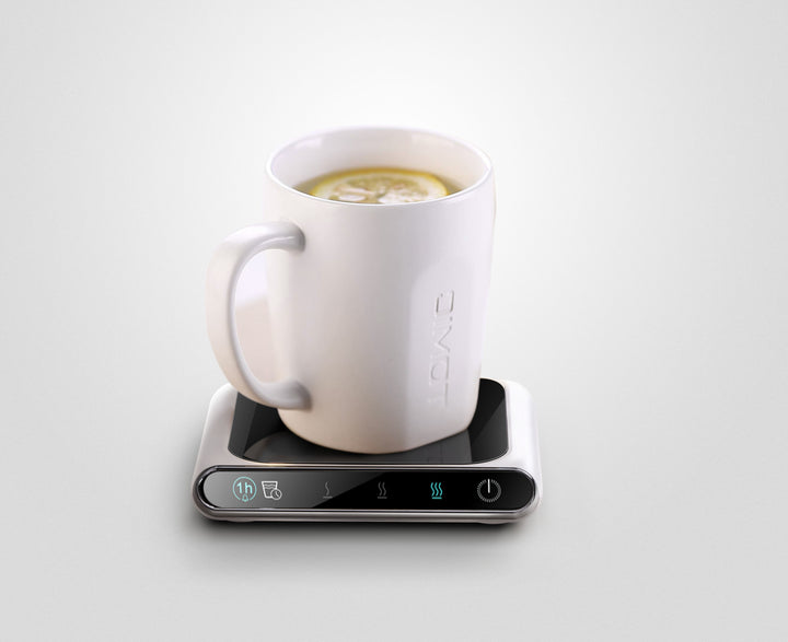 White glass cup warmer coaster with mug