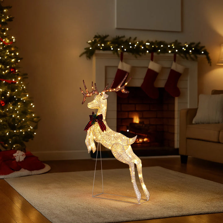 Light-up jumping reindeer with red bow