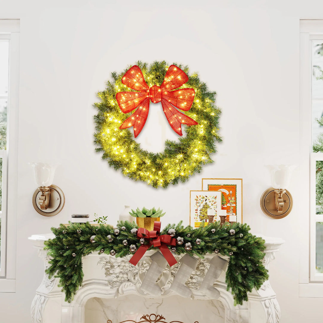 Large lit Christmas wreath with red bow