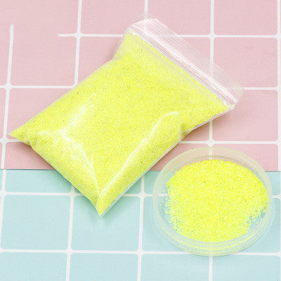 Coloured magic sand shaped underwater