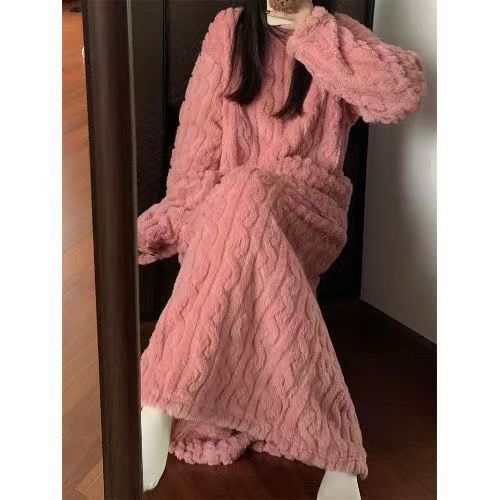 Woman in long pink coral fleece nightgown