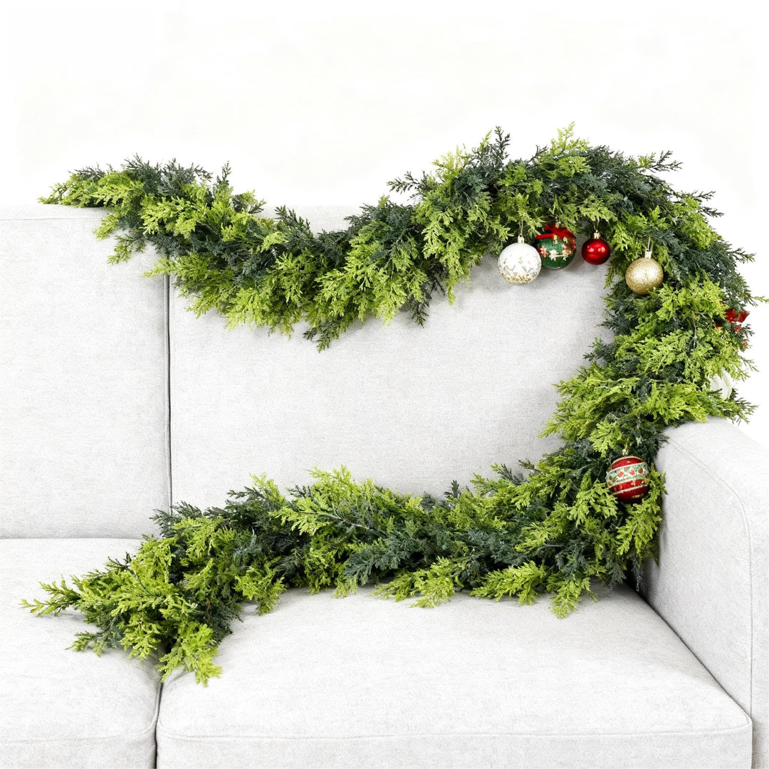 Green Norfolk pine garland on a mantelpiece