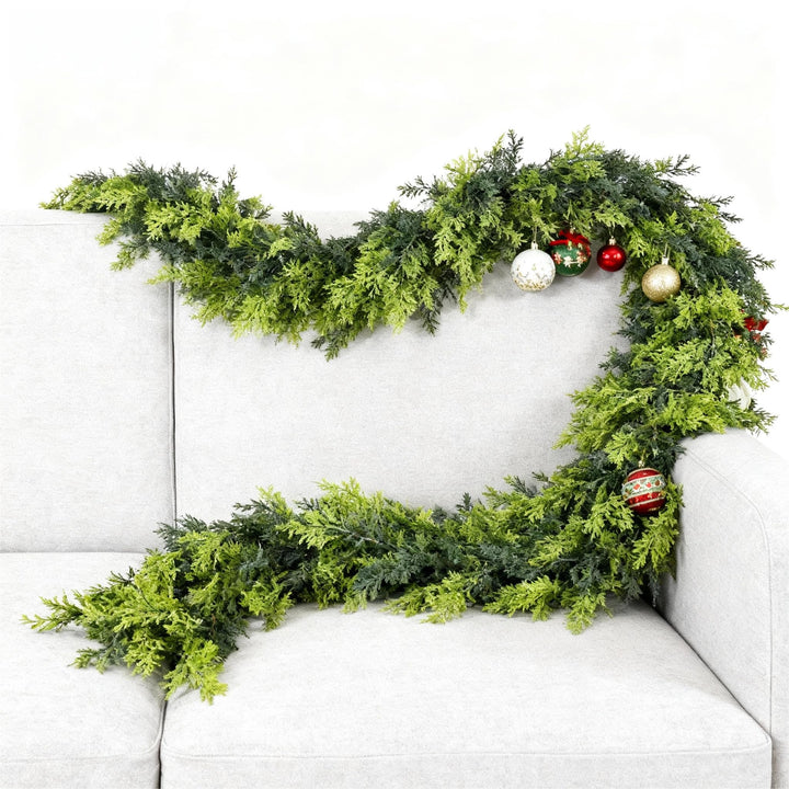 Green Norfolk pine garland on a mantelpiece