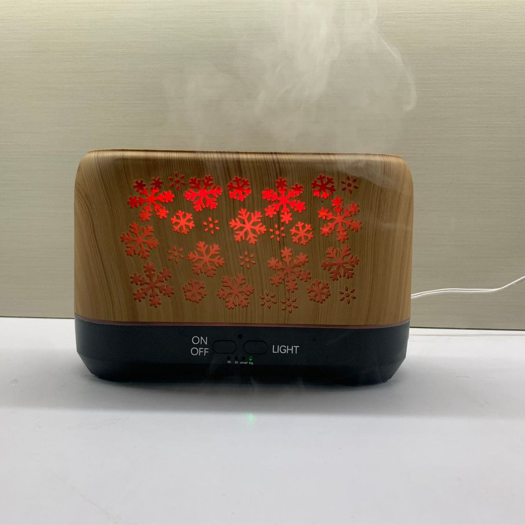 Snowflake flame diffuser with orange mist