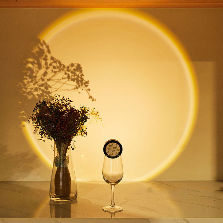 Round light casting sunset glow on wall