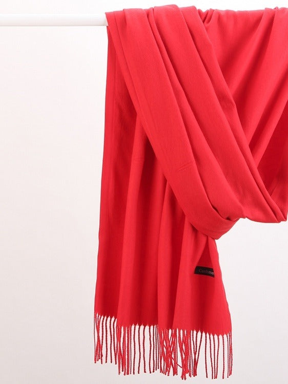 Woman in soft fringed scarf