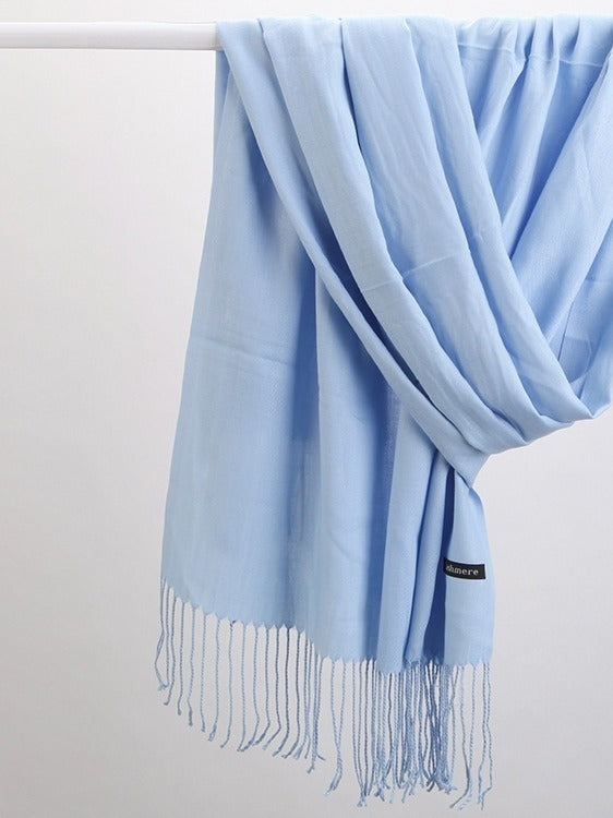 Woman in soft fringed scarf