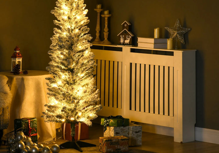 Slim white-flocked pencil tree with warm lights