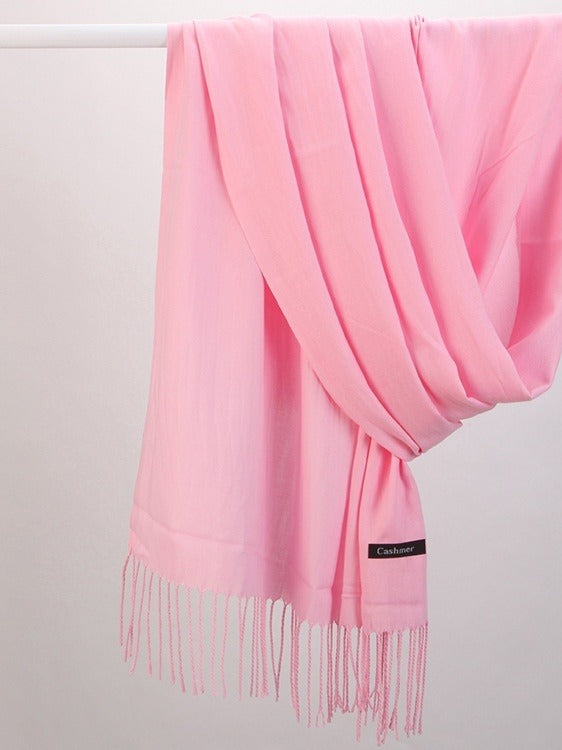 Woman in soft fringed scarf
