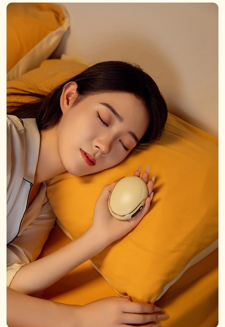 Pink egg shaped rechargeable hand warmer