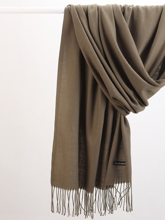 Woman in soft fringed scarf
