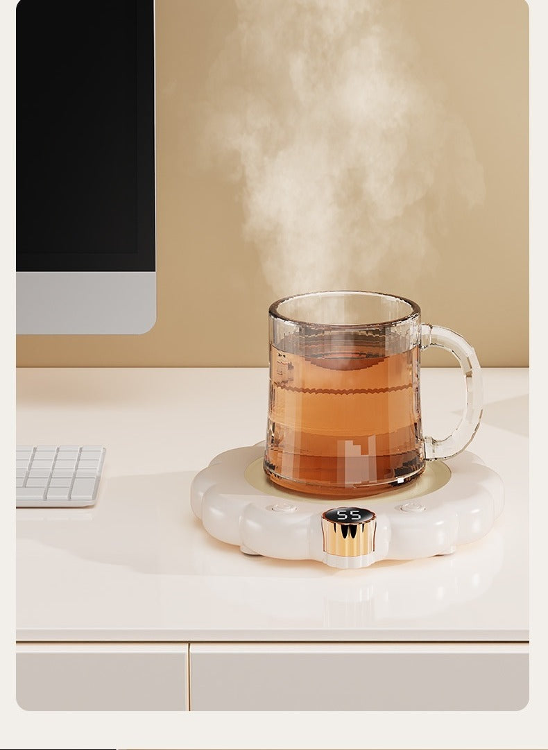 Flower-shaped mug warmer with cup of coffee
